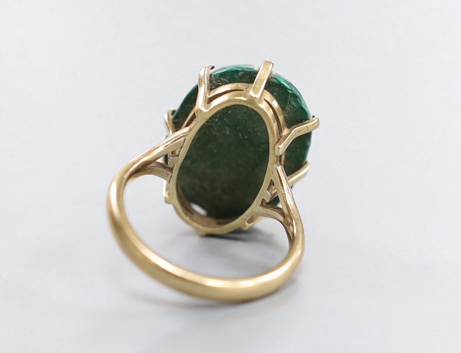 A 9ct gold and malachite set oval ring, size P/Q and a pair of similar earrings, gross weight 20.4 grams.